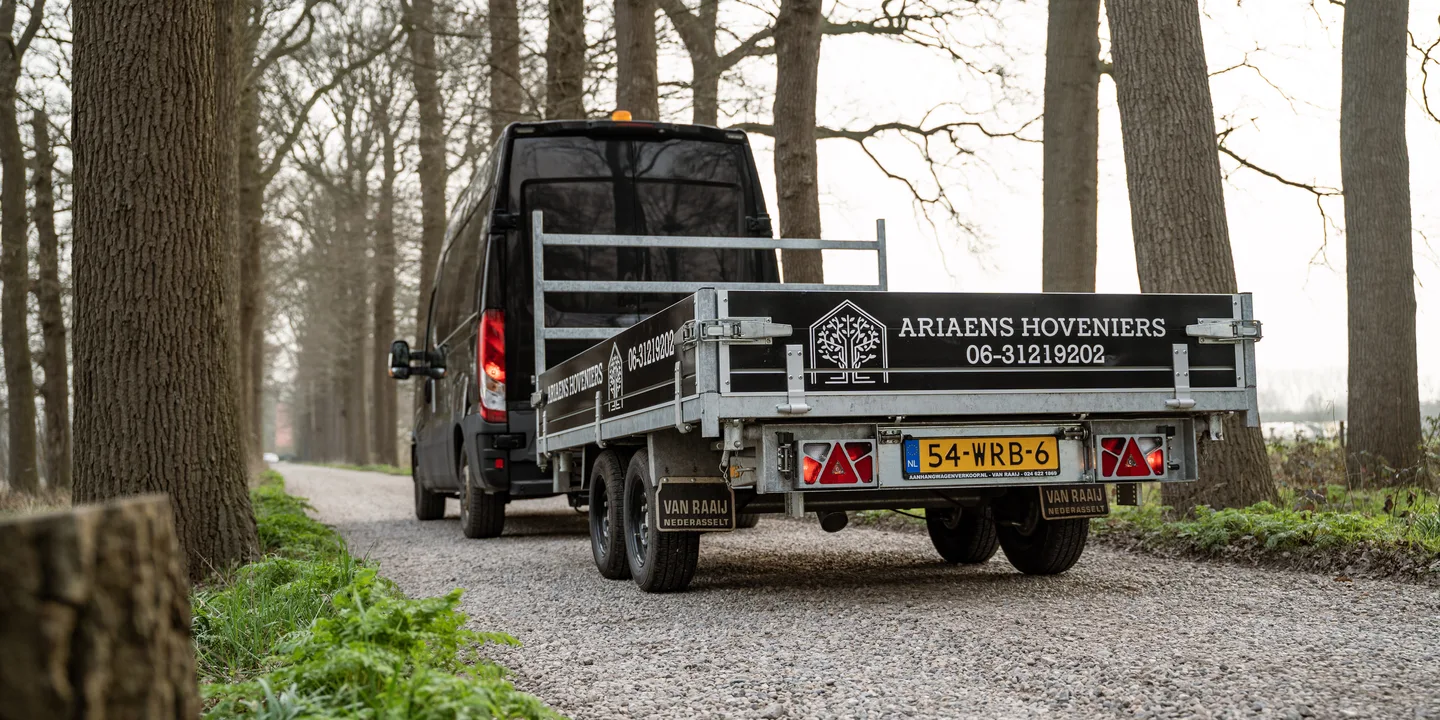 Arieans Hoveniers work van among the trees